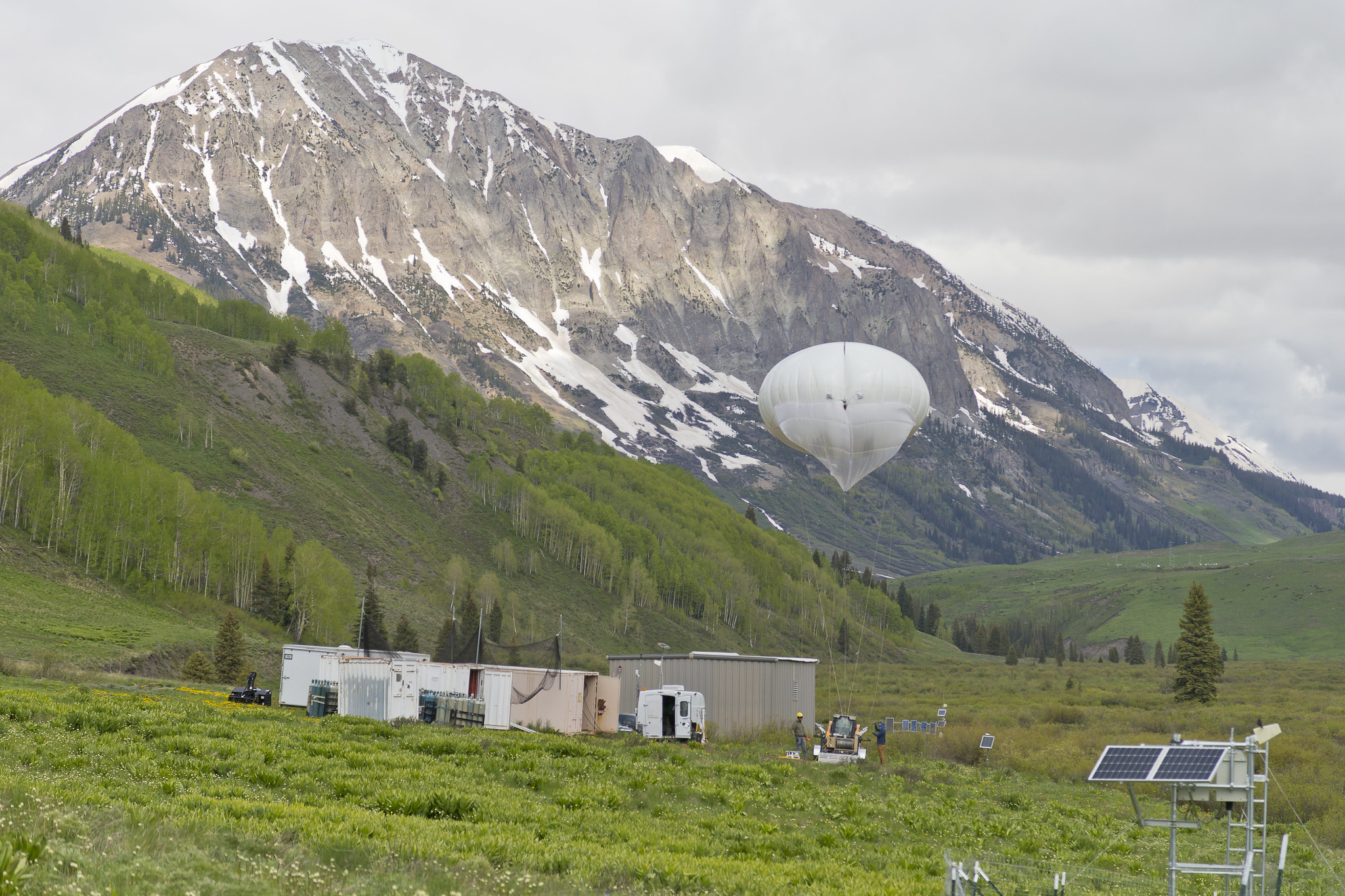 tethered balloon in green field